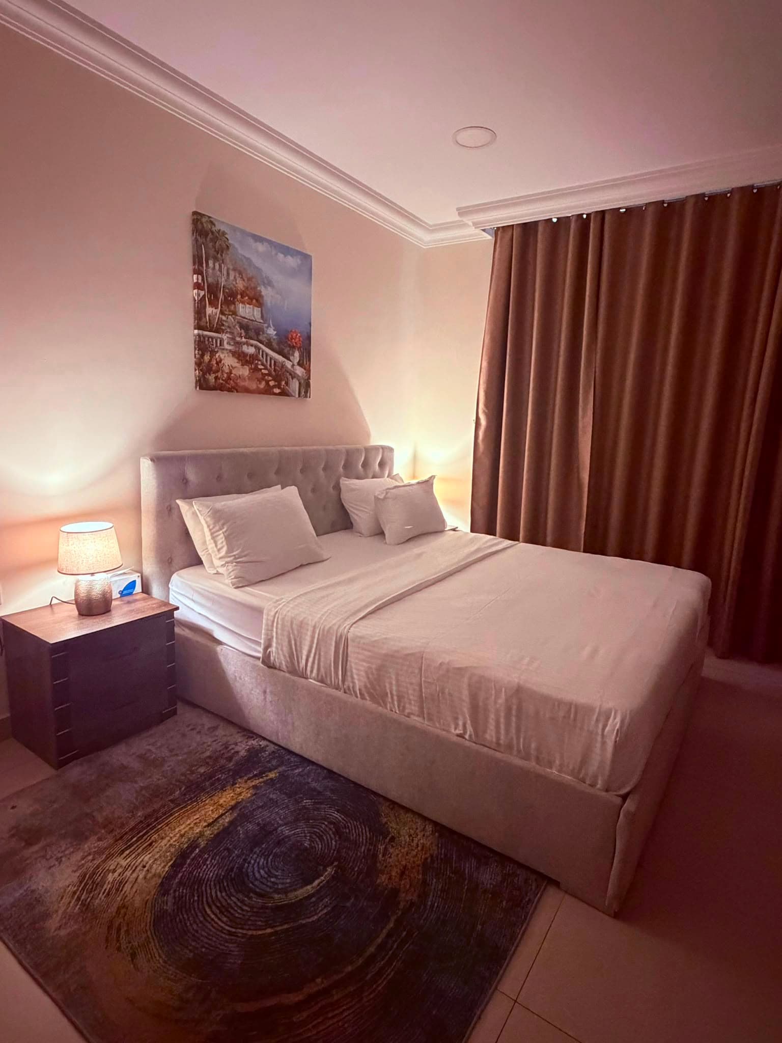 Double bedroom with warm bedside lighting at Chelsea Gardens